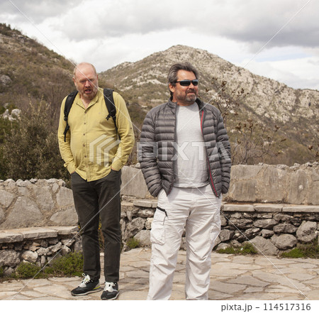 senior friends tourists outdoor adventure together on mediterranian sea landscape 114517316