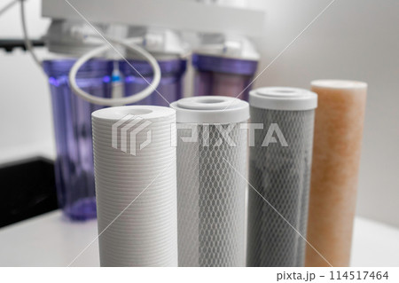Filters for reverse osmosis on the table for water purification in the modern kitchen.  114517464
