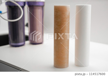 Two used and new water filters. Replacement of dirty filters for water filtration by reverse osmosis Two used and new water filters. Replacement of dirty filters for water filtration by reverse osmosis 114517600
