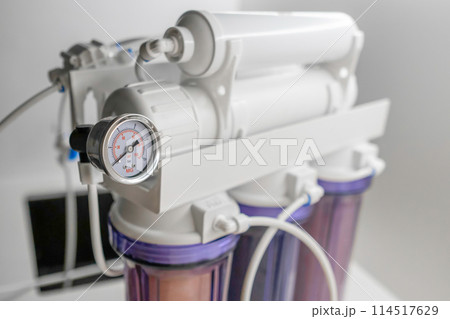 Close up mineralizer in a reverse osmosis system for water purification at home. Close up mineralizer in a reverse osmosis system for water purification at home. 114517629