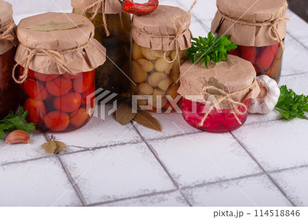 Pickled vegetables in glass jars. Pickled vegetables in glass jars. 114518846