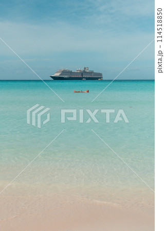 Man enjoing lounging on the ocean at Half moon cay Bahamas private island Caribbean 114518850