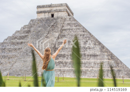 Beautiful tourist woman observing the old pyramid and temple of the castle of the Mayan architecture known as Chichen Itza these are the ruins of this ancient pre-columbian civilization and part of Beautiful tourist woman observing the old pyramid and temple of the castle of the Mayan architecture known as Chichen Itza these are the ruins of this ancient pre-columbian civilization and part of 114519169