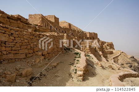 Ancient stone houses and on the mountain slopes in Guermassa region. South Tunisia. Tatouine governorate,Tunisia 114522845