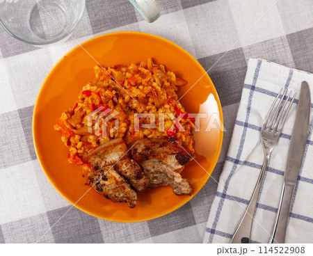 On white plate-grilled brisket pork garnished with pearl barley. 114522908