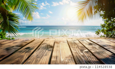 empty wooden table and landscape of beach with palms and ocean empty wooden table and landscape of beach with palms and ocean 114528538