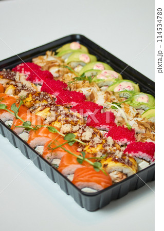 Sushi roll Philadelphia with salmon, smoked eel, avocado, cream cheese on black background. Sushi menu. Japanese food. 114534780