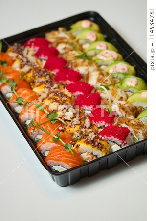 Sushi roll Philadelphia with salmon, smoked eel, avocado, cream cheese on black background. Sushi menu. Japanese food. 114534781