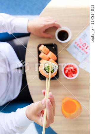 Sushi roll Philadelphia with salmon, smoked eel, avocado, cream cheese on black background. Sushi menu. Japanese food. 114534813