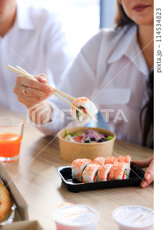 Sushi roll Philadelphia with salmon, smoked eel, avocado, cream cheese on black background. Sushi menu. Japanese food. 114534823