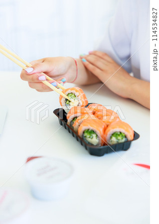 Sushi roll Philadelphia with salmon, smoked eel, avocado, cream cheese on black background. Sushi menu. Japanese food. 114534827