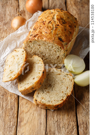 Homemade fragrant Caramelized Onion Bread closeup on the wooden board. Vertical 114538180