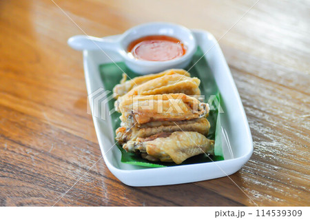 chicken wings or deep fried chicken , fried chicken and sauce chicken wings or deep fried chicken , fried chicken and sauce 114539309