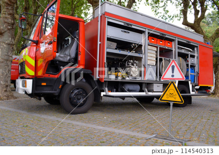Fire truck with open doors on a sunny day. Fire truck with open doors on a sunny day. 114540313