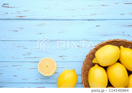 Lemon isolated in basket on blue background. Tropical fruit. 114540964