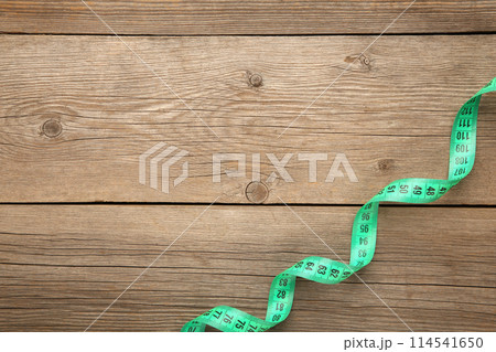 Measuring tape of the tailor, on a white background Measuring tape of the tailor, on a white background 114541650