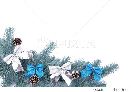 Fir tree branches with christmas decoration on a white background 114541652