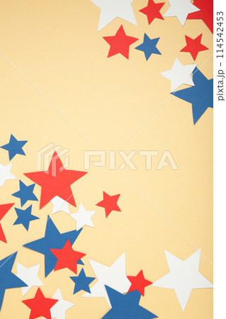 American independence day, celebration, patriotism and holidays concept - red, white and blue paper stars on beige background. 114542453