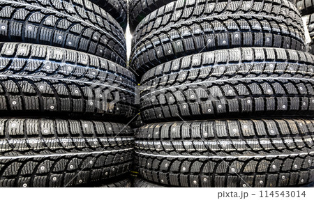 Winter tires stacked up for sale in the superstore 114543014
