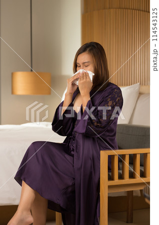 Asia woman in a silk nightgown finds no comfort. 114543125