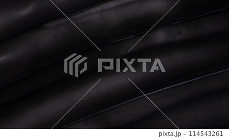 Texture of black charcoal face mask. Abstract black charcoal toothpaste or hair dye background for design. Texture of black charcoal face mask. Abstract black charcoal toothpaste or hair dye background for design. 114543261