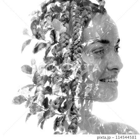 A black and white creative double exposure portrait of a smiling woman A black and white creative double exposure portrait of a smiling woman 114544581