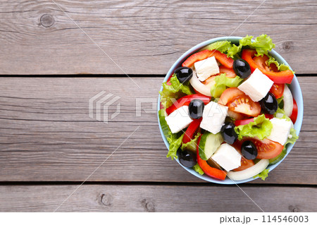 Fresh vegetable salad on grey wooden background 114546003