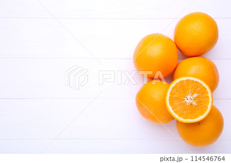 Orange fruit on a white wooden background 114546764