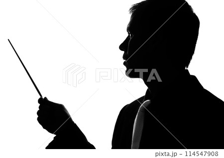 Young man in suit and tie shows pointer forward 114547908