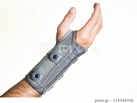 Bandage wrist with pressure regulator on a man's hand - isolate Bandage wrist with pressure regulator on a man's hand - isolate 114548356
