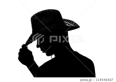 Young man holds the hand hat silhouette 114548387