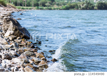 Sea wave on a granite beach Sea wave on a granite beach 114549490
