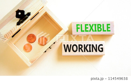 Flexible working symbol. Concept words Flexible working on beautiful wooden block. Beautiful white paper background. Wooden chest with coins. Business flexible working concept. Copy space. Flexible working symbol. Concept words Flexible working on beautiful wooden block. Beautiful white paper background. Wooden chest with coins. Business flexible working concept. Copy space. 114549638