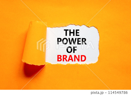 The power of brand symbol. Concept words The power of brand on beautiful white paper. Beautiful orange background. Business the power of brand concept. Copy space. The power of brand symbol. Concept words The power of brand on beautiful white paper. Beautiful orange background. Business the power of brand concept. Copy space. 114549786