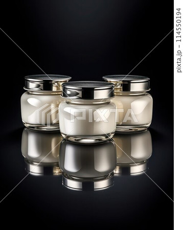 3 similar white glass jars with cosmetic product stand on glossy black background, vertical photo, close-up. 114550194