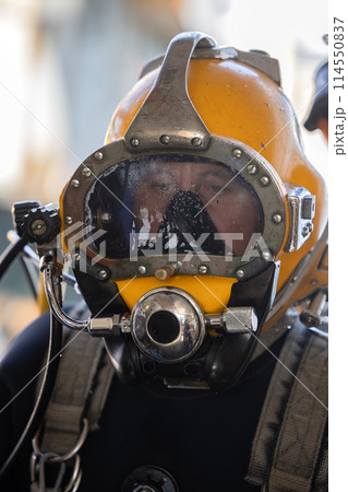 Closeup of commercial diver in helmet Closeup of commercial diver in helmet 114550837