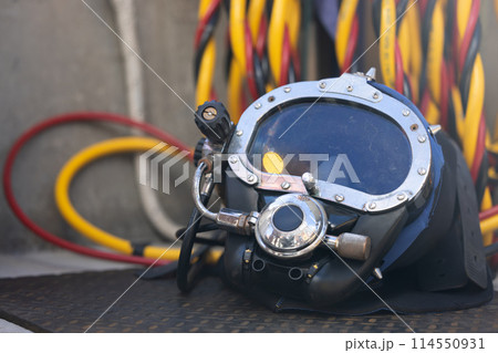 Closeup of commercial diving helmet on the boat 114550931