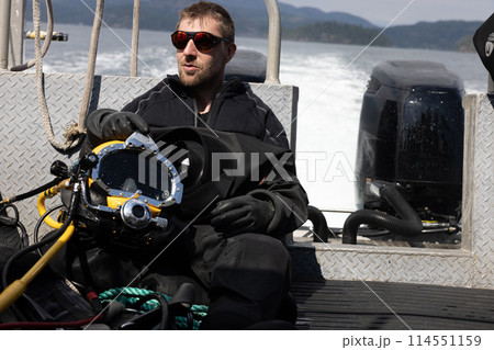 Closeup of commercial diver in helmet Closeup of commercial diver in helmet 114551159