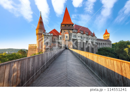 Amazing morning view of Hunyad Castle / Corvin's Castle with wooden bridge. Amazing morning view of Hunyad Castle / Corvin's Castle with wooden bridge. 114551241