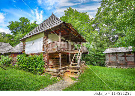 Gorgeous summer scene of traditional romanian peasant houses. Gorgeous summer scene of traditional romanian peasant houses. 114551253