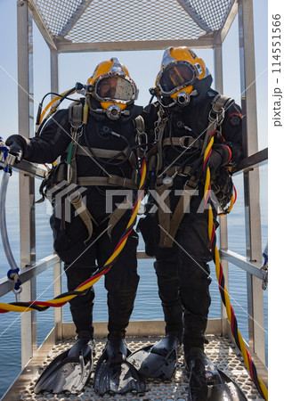Commercial diver prepared for deep water entry 114551566