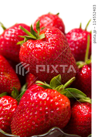 Ripe tasty strawberries with green leaves Ripe tasty strawberries with green leaves 114552403