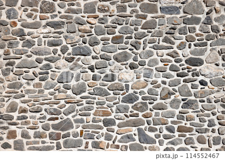 Wall constructed with various natural stones Wall constructed with various natural stones 114552467