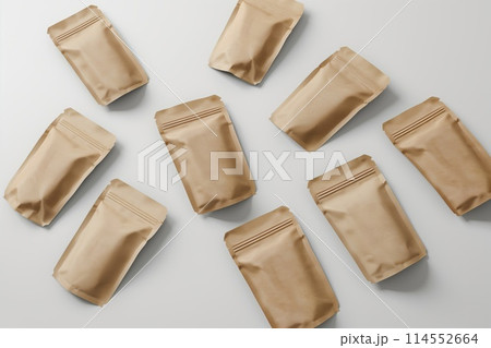 Collection of empty brown kraft paper bags on a clean white surface 114552664