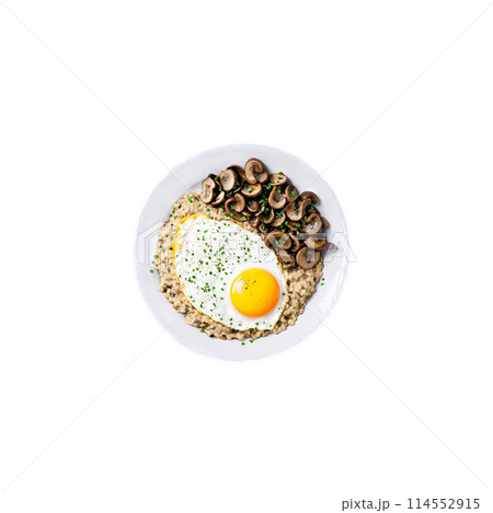 Savory oatmeal creamy oats topped with a fried egg sauteed mushrooms 114552915