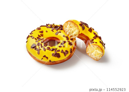 Fluffy donuts with tropic fruit flavored buttercream and yellow icing Fluffy donuts with tropic fruit flavored buttercream and yellow icing 114552923
