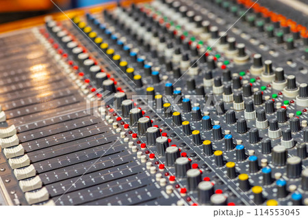 Closeup of audio mixer control panel 114553045