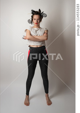 beautiful brunette housewife girl with kitchen utensils in her hair instead of curlers beautiful brunette housewife girl with kitchen utensils in her hair instead of curlers 114553283