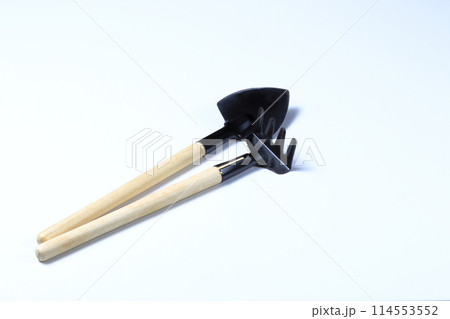 rake and shovel, Set of gardening supplies, tools to cultivate gardens, Basic gardening tools isolated on white background. rake and shovel, Set of gardening supplies, tools to cultivate gardens, Basic gardening tools isolated on white background. 114553552