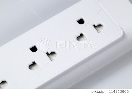 Closeup of electrical power strip or extension block on white background. 114553906